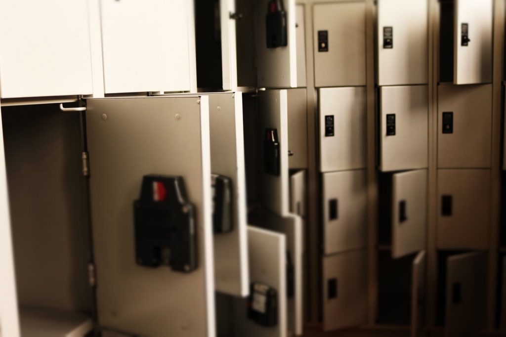 Storage lockers with many open doors.