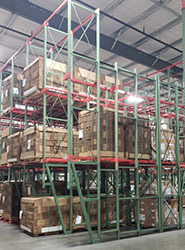 Drive-through pallet racking system with pallets on it
