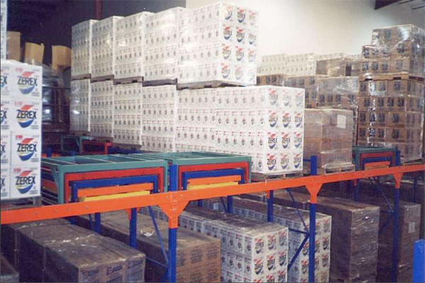 Image of organized inventory held on multiple pushback shelves inside a warehouse.