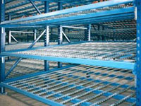 Empty carton flow rack in a warehouse.