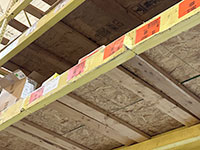 Underside of a damaged pallet rack that should be examined.