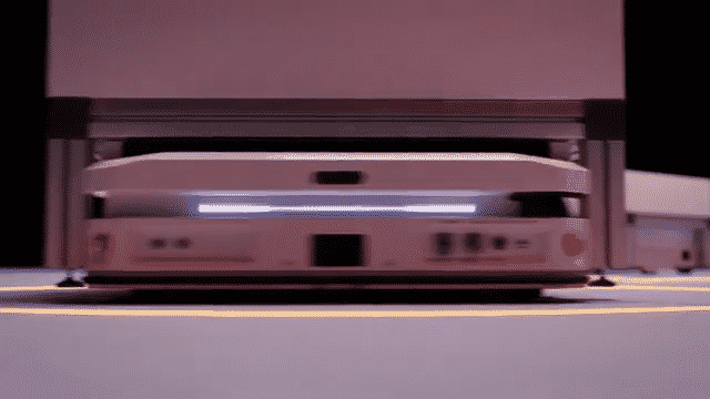 AMR robots move and spin across the floor of a facility