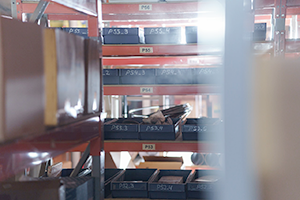 Warehouse shelves with clearly labeled shelf and bin numbers.