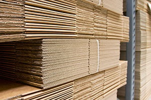 Stacks of flat boxes ready to be used for shipping products.