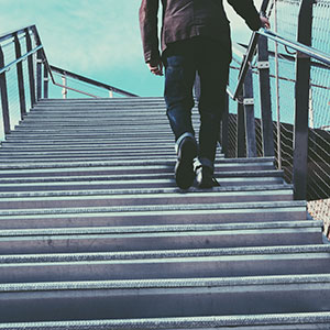 Man climbing an outdoor staircase.