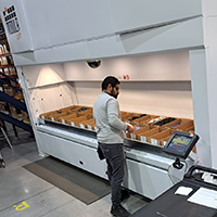 Employee picks from a vertical lift module