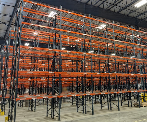 A pallet rack system situated between shelves