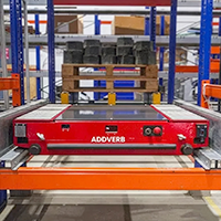 A pallet shuttle inside pallet rack system