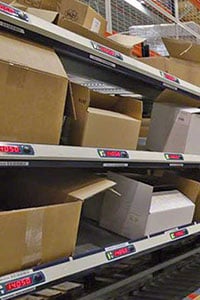 Boxes on shelves with a pick to light system.