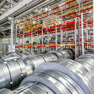 Rows of steel that are ready to be stored in a warehouse.