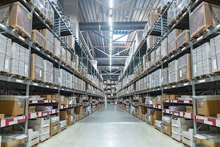 Warehouse racking with a wide aisle.