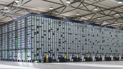 Warehouse employees operate ASRS Opex Infinity system