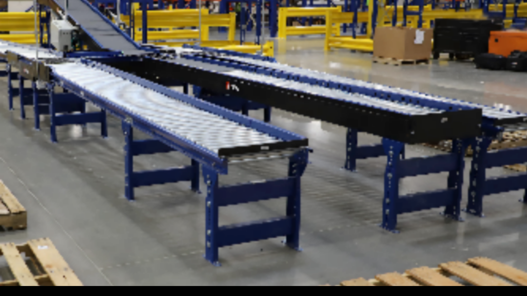 Three MDR conveyors lined up in a warehouse operation