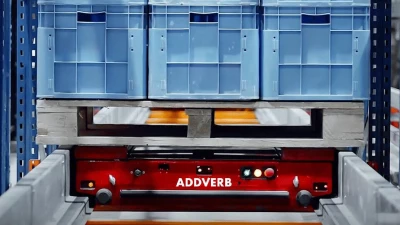 Pallet shuttle sits inside racking system ready to put away palletized goods