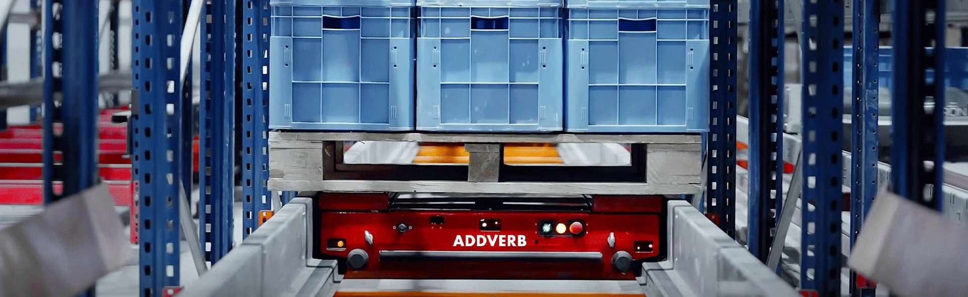 Pallet shuttle sits inside racking system ready to put away palletized goods