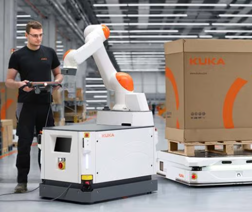 Warehouse employee sets up an autonomous mobile robot