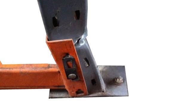 Damaged pallet rack upright column.